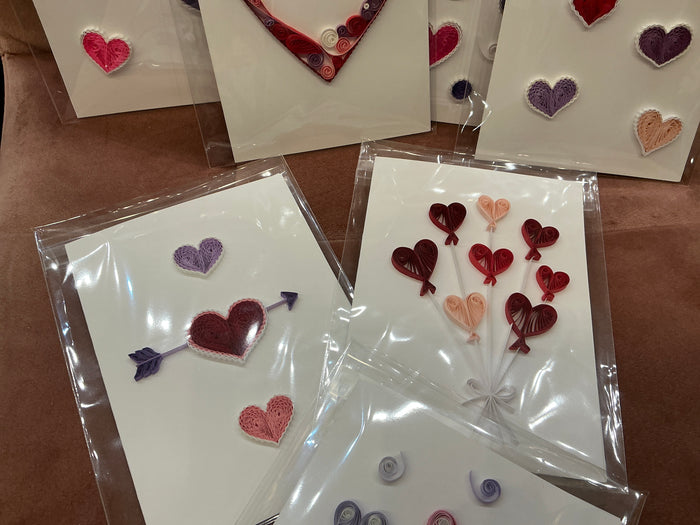 Colorful quilled heart cards by Cat's Quilling, featuring intricate paper quilling designs on white greeting cards.