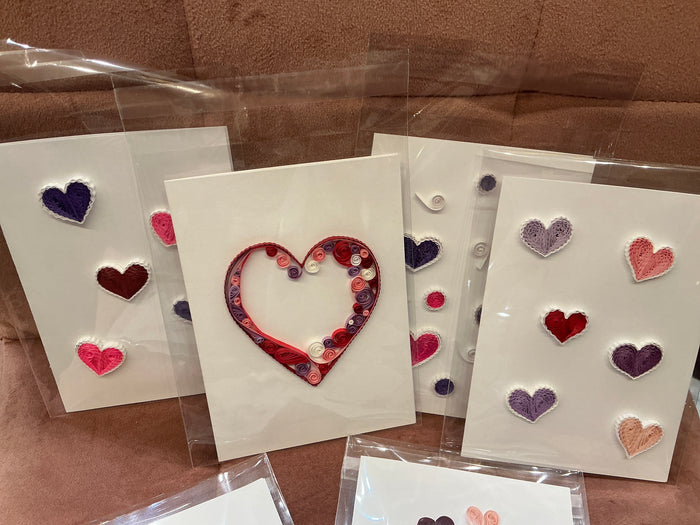 Colorful quilled heart cards by Cat's Quilling featuring intricate paper quilling designs on greeting cards.