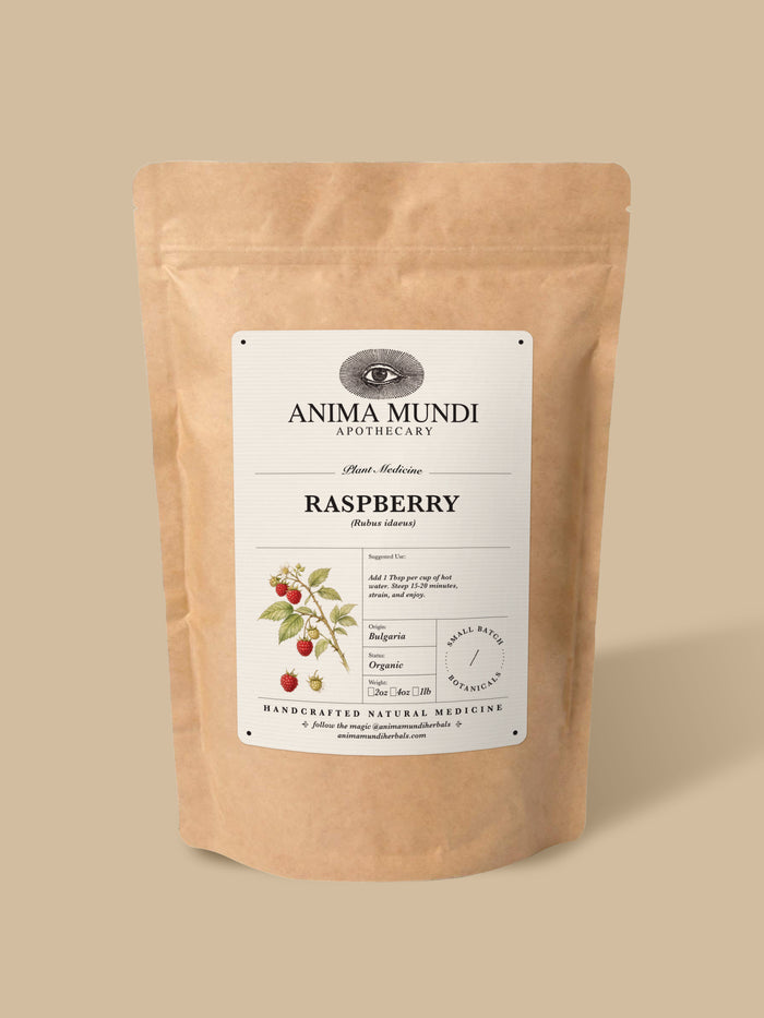 A stand-up kraft paper pouch of Anima Mundi Apothecary Raspberry herbal medicine, shown on a solid beige background.