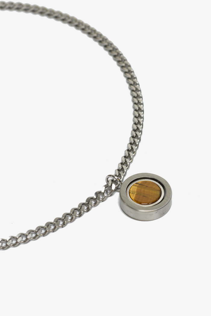 Reversible pendant necklace by Curated Basics, showing both sides of the stylish, versatile jewelry piece.