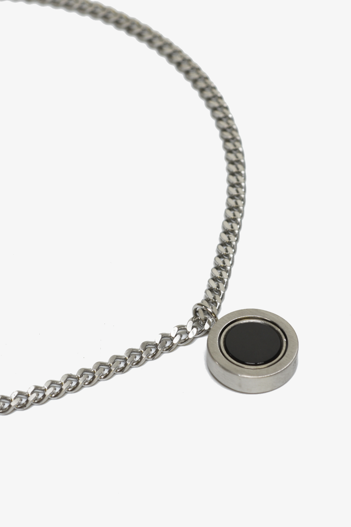 Reversible pendant necklace by Curated Basics, featuring a versatile design with two different pendant styles on a chain.