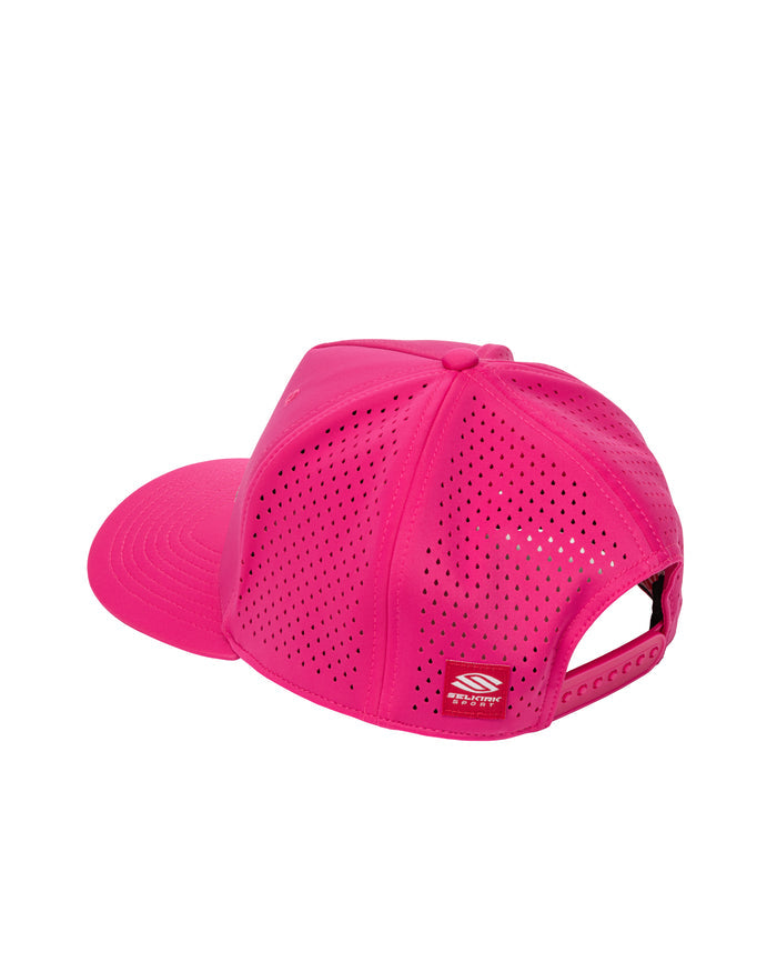Hot pink perforated snapback cap, rear three-quarter view, adjustable snap closure and small woven logo patch