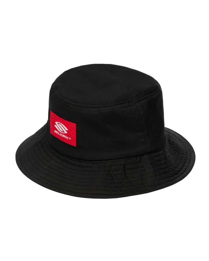 Black bucket hat with red patch reading SELKIRK TM and white stylized S logo