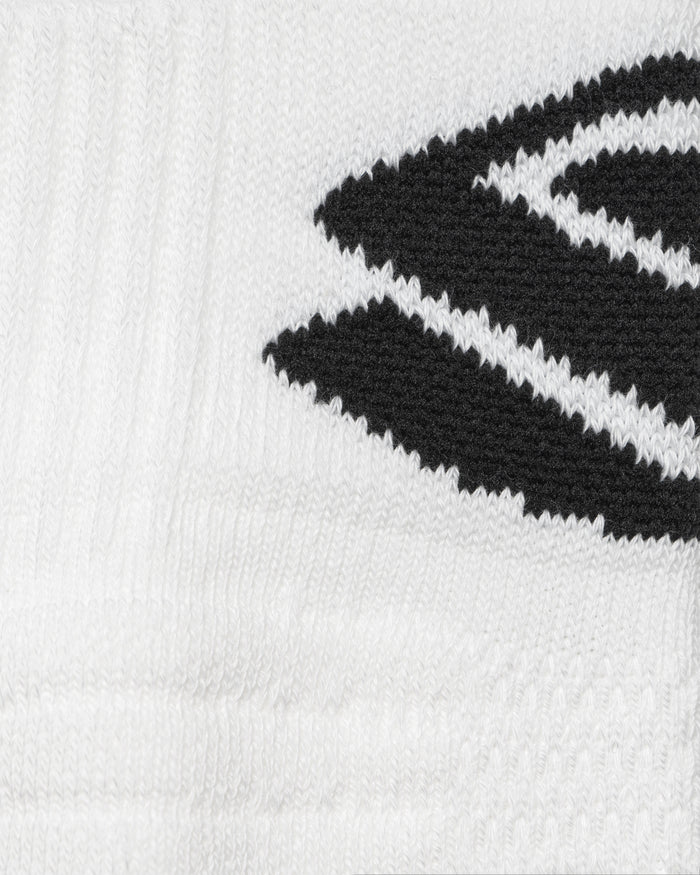 Close-up, white knitted sock with black angled stripe detail