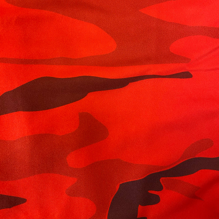 Red camouflage fabric with dark maroon abstract splotches