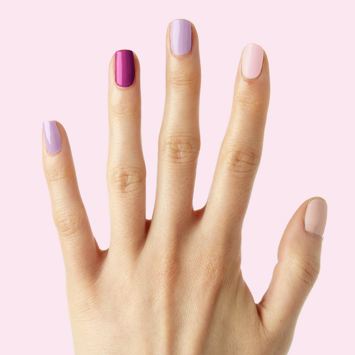Sheer Luck manicure showing a delicate blend of pink and purple shades with long-lasting polish on natural nails