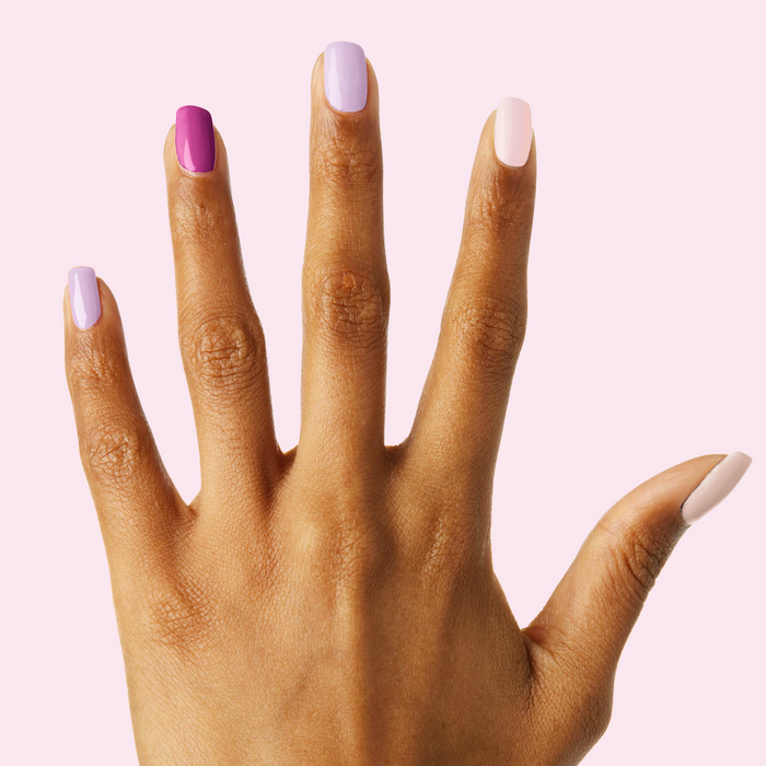 Sheer Luck manicure featuring soft pink and purple shades on natural nails with a smooth, long-lasting finish