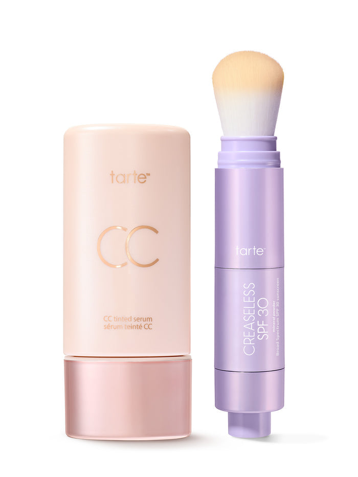 Tarte CC cream and brush on a white background