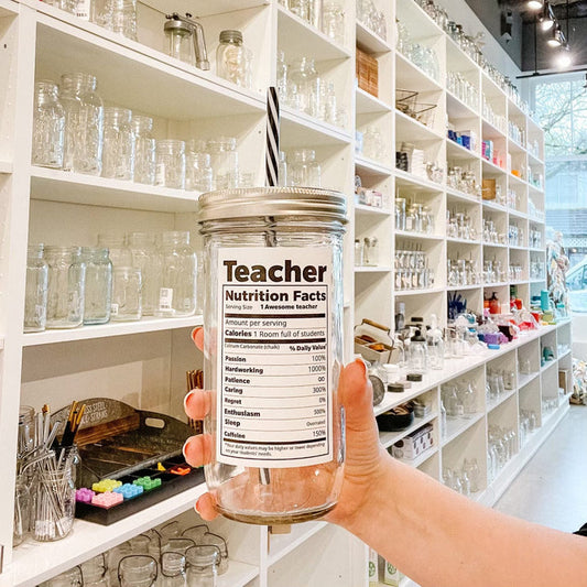 Mason jar tumbler with a "Teacher 'nutritional facts'" text