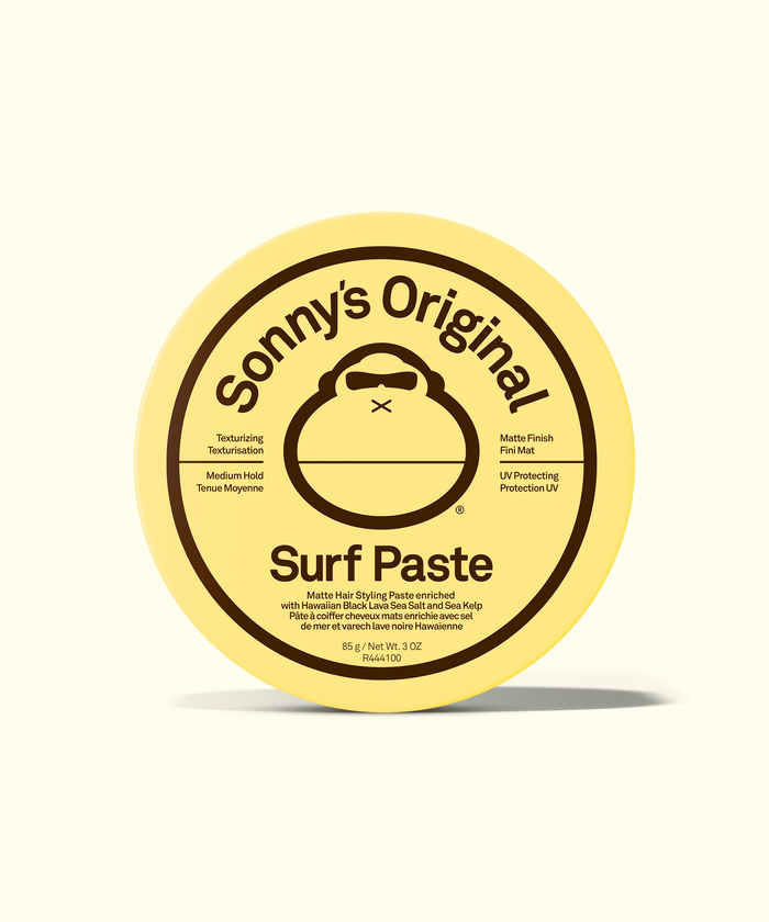 Yellow container of Sonny's Original Surf Paste with black text on a white background