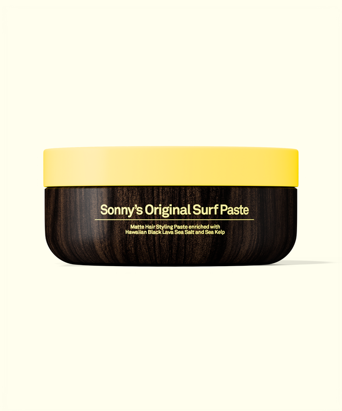 Jar of Sonny's Original Surf Paste with yellow lid and wooden texture
