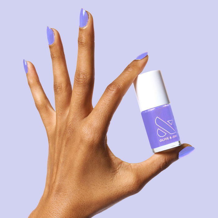 The Bold Mama Set featuring hand with periwinkle nail polish holding matching Olive and June nail polish bottle