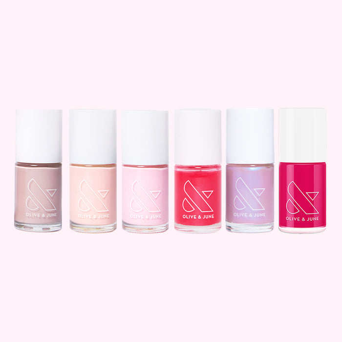 The Pink Mama Set displaying six pink and red nail polishes for at home mani and long-lasting polish options