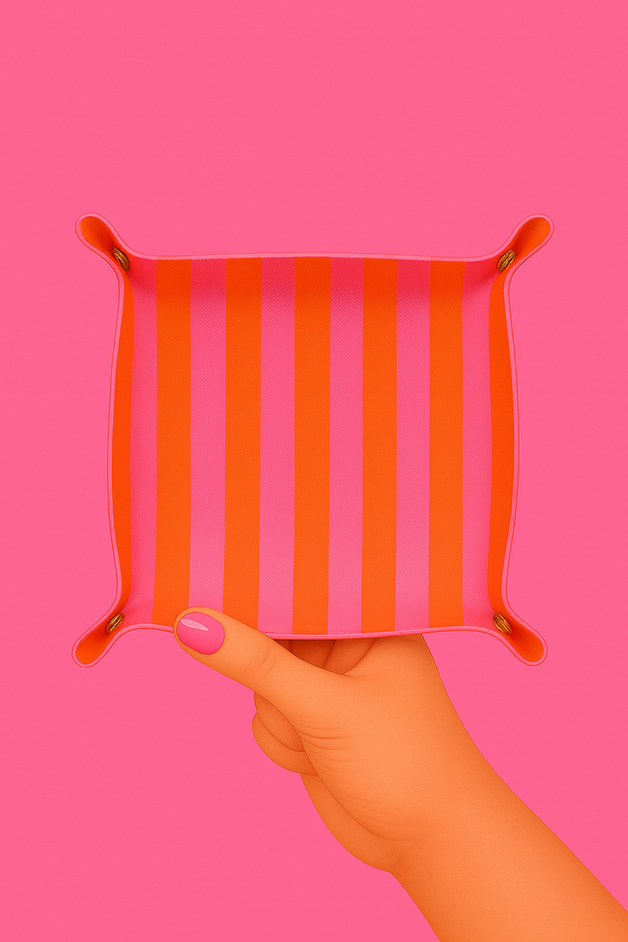 Pink and orange striped Aspen Lane trinket tray with a rectangular shape and smooth finish, perfect for organizing jewelry and small items.