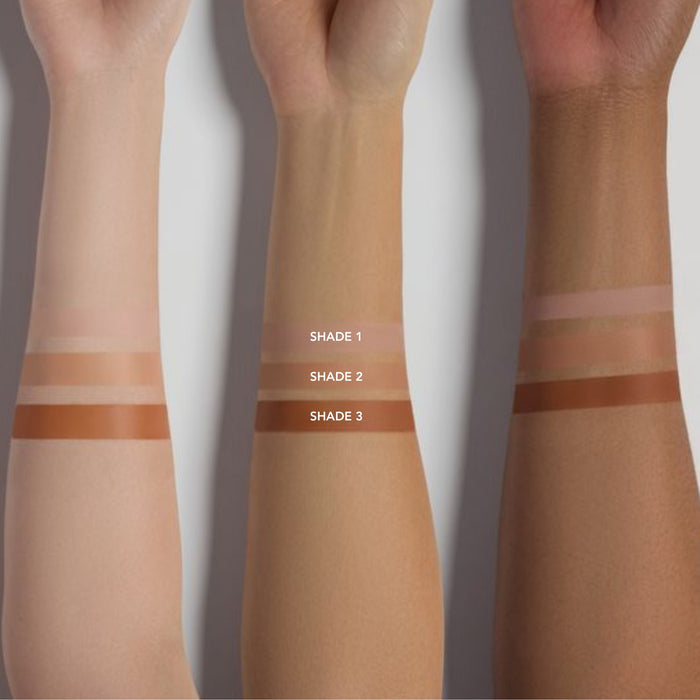 Three swatches of different shades on a person's arm