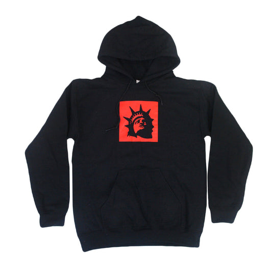 Trophy Eyes black hoodie with a front pocket, featuring a red square on the chest with a black Statue of Liberty head graphic—an iconic piece from the Liberty Square Black collection.