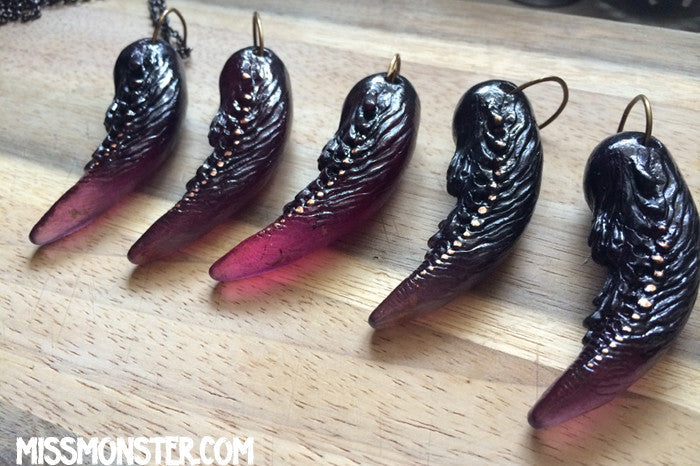 TUSK OF APOPHIS PENDANT- PURPLE