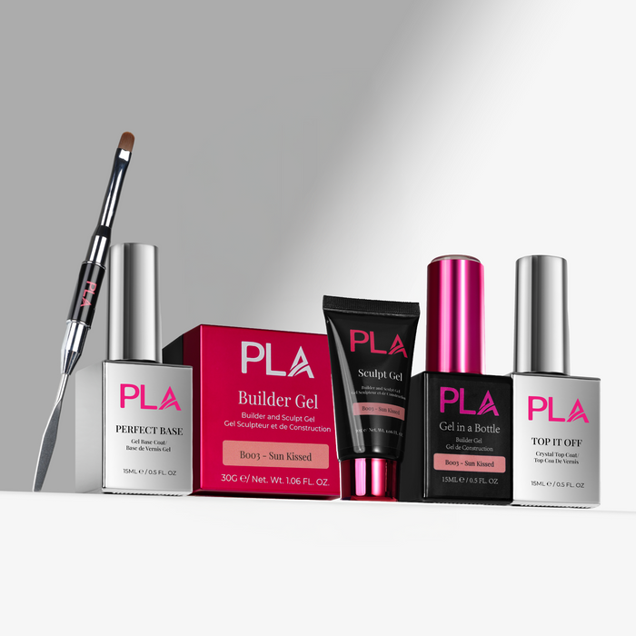 Collection of PLA nail products including bottles, a brush, and a box on a gray background
