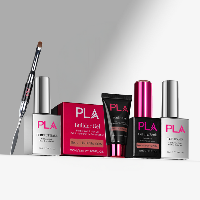 Set of PLA nail products including bottles, a brush, and a box on a gray background