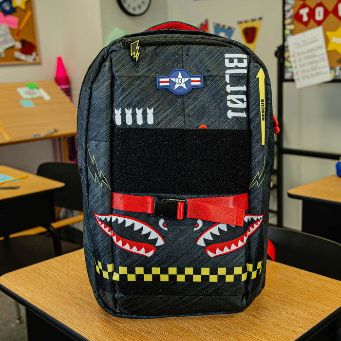 Adult model wearing multi-color backpack with "Unit 101 SZN 2" design