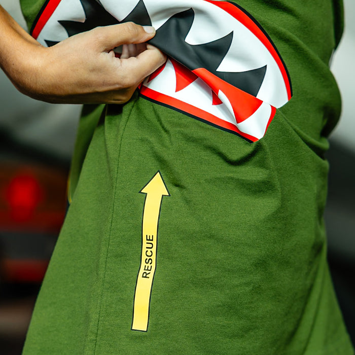 Close up of Army green graphic T-Shirt with shark mouth print, military star emblem, BL101 armor logo on sleeve and bold while BL101 lettering on person