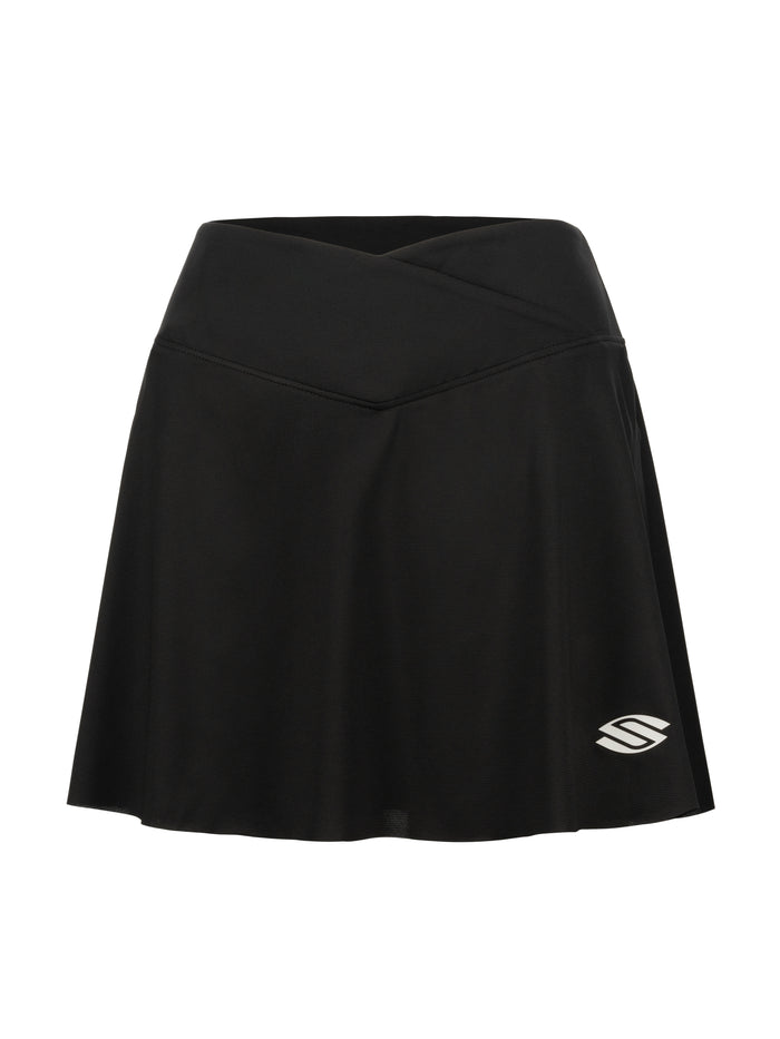 Black athletic skort with crossover waistband and small white stylized S logo at lower-right hem